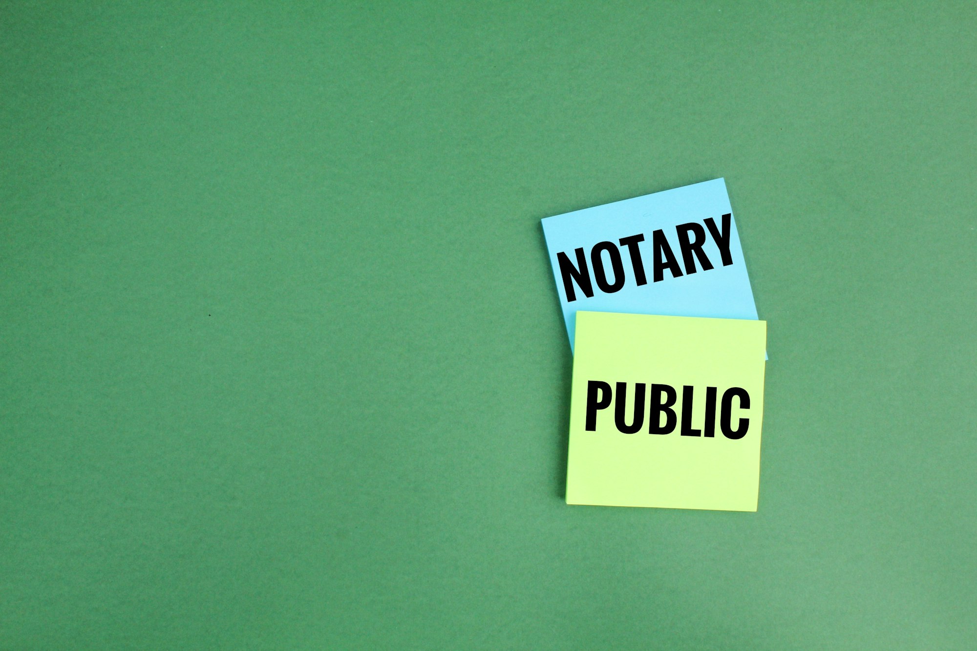 colored paper with the words Notary Public.